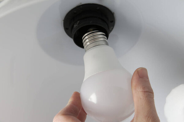 Replacing light bulb at home. Simple DIY housework maintaince.