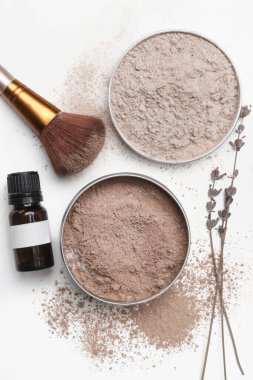 A jar of organic non-toxic chemicals free dry shampoo. DIY project for healthy low toxic living. Simple shampoo powder containing just natural ingredients, cocoa powder, cornstarch and essential oil. clipart