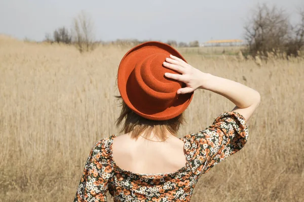 Candid Outdoor Portrait Young Woman Dark Floral Dress Orange Hat — Stock Photo, Image