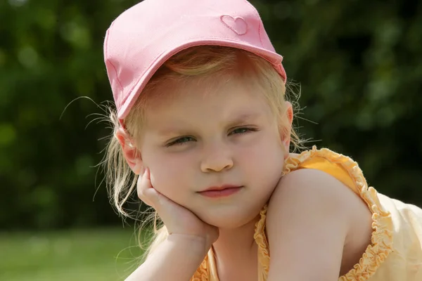 Portrait Adorable Toddler Girl Pink Summer Hat Laying Green Meadow — Stock Photo, Image