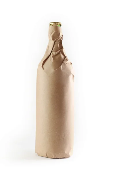 Bottle wrapped in paper bag — Stock Photo, Image