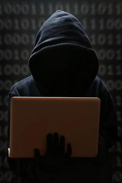 Silhouette of a hacker looking in monitor — Stock Photo, Image
