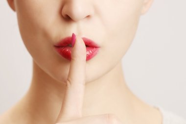 Finger on lips - silent gesture clipart