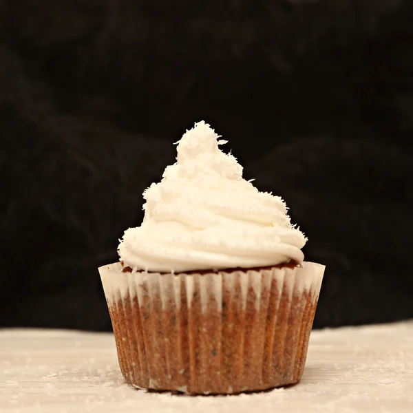 Cupcake with cream frosting — Stock Photo, Image