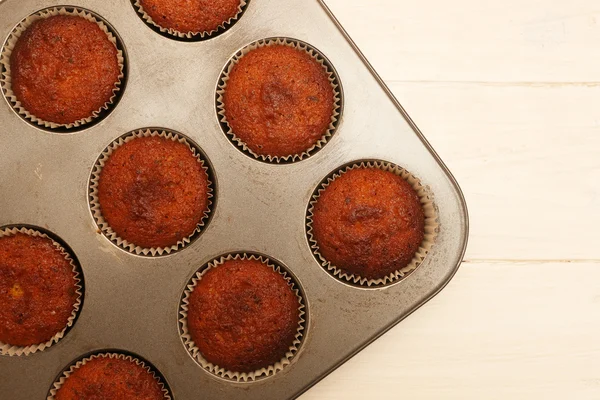 Top view on fresh baked chocolate muffins — Stock Photo, Image