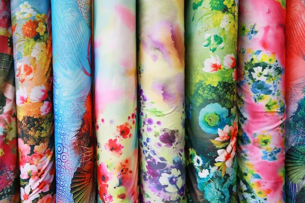 A variety of different bolts of colorful silk fabric — Stock Photo, Image