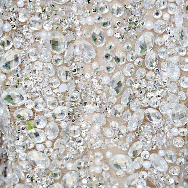 Close up of a dress all covered with shiny white rhinestones — Stock Photo, Image