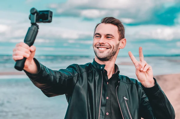 Handsome Guy Making Selfie at the Beach