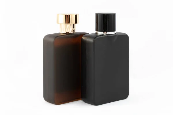 Duas garrafas de perfume fosco para homens em fundo branco — Fotografia de Stock