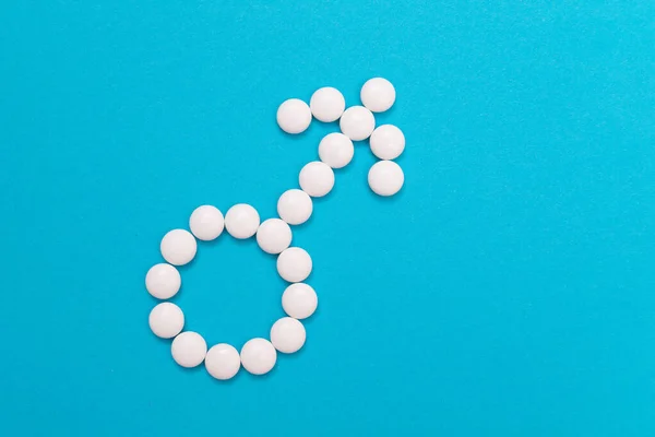 Male Gender Symbol Made from White Pills