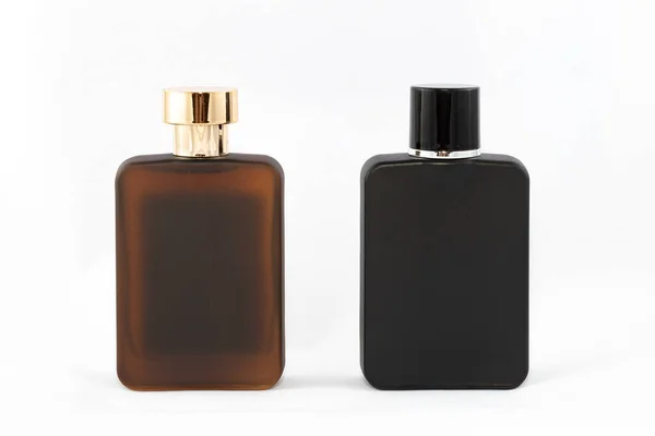 Duas garrafas de perfume fosco para homens em fundo branco — Fotografia de Stock