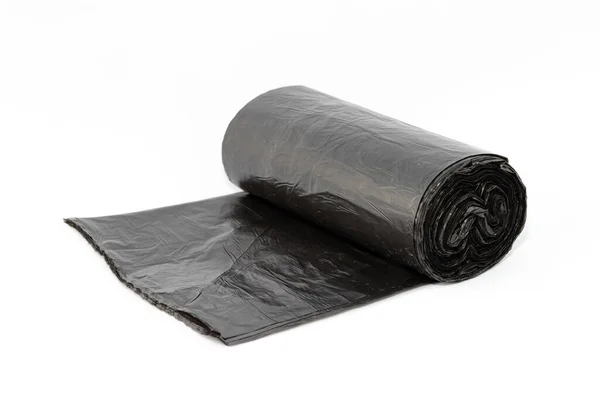 Черные полиэтиленовые мешки для мусора на белом фоне — стоковое фото
