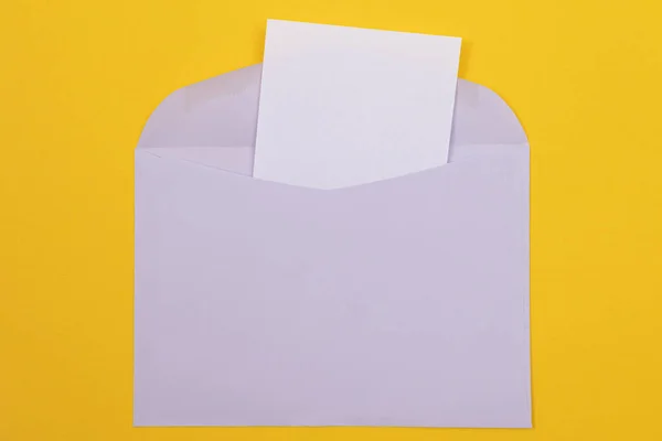 Violet Envelope with Blank White Sheet of Paper Inside — 스톡 사진