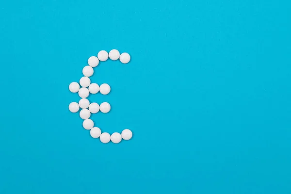 Pharmaceutical Industry and Business - Euro Symbol Made from White Pills — Stock Photo, Image