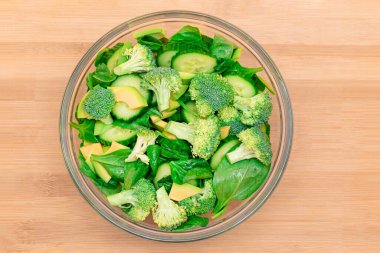 Fresh Green Salad of Avocado, Broccoli, Spinach and Cucumber for Body Detoxification clipart