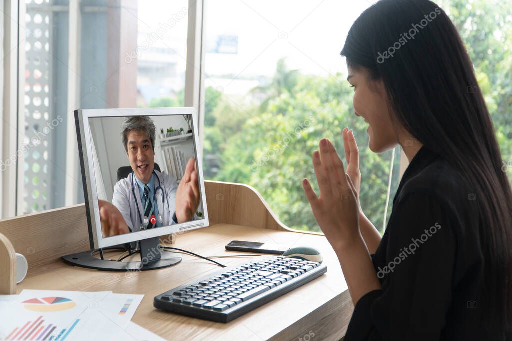 Asian doctor or therapist help relieve stress and provide knowledge and understanding about office syndrome to patients video conference call online live talk remotely at home