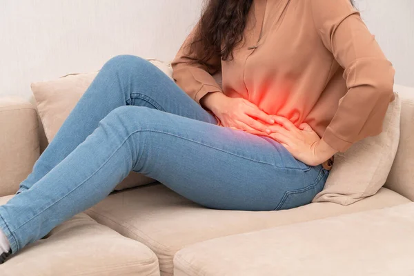 Unhappy Asian Woman Sitting Sofa Holding Stomach Suffering Abdominal Pain — Stock Photo, Image