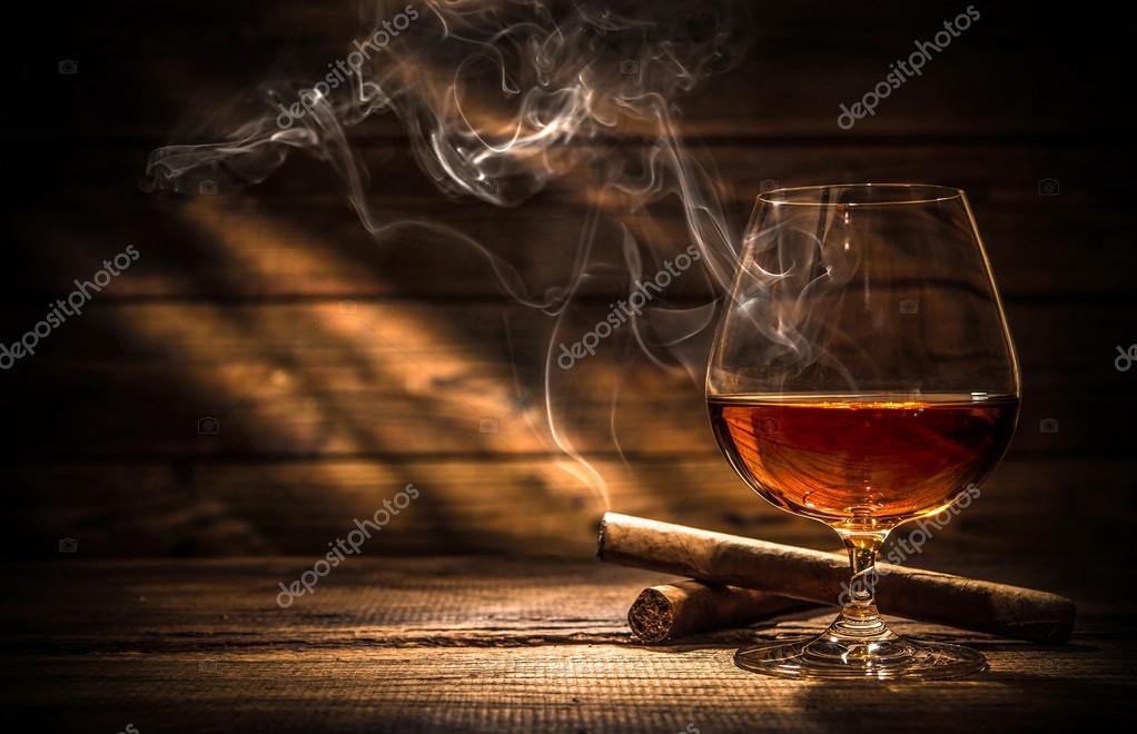 Whiskey with smoking cigar Stock Photo by ©alexraths 103497934