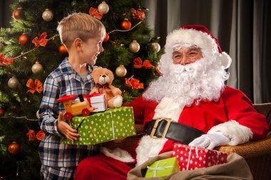 Santa Claus and a little boy clipart