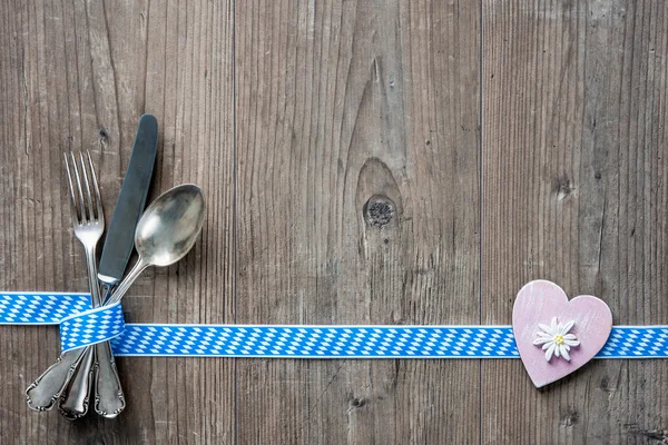 Bavarian cutlery on wooden table with copy space — Stock Photo, Image