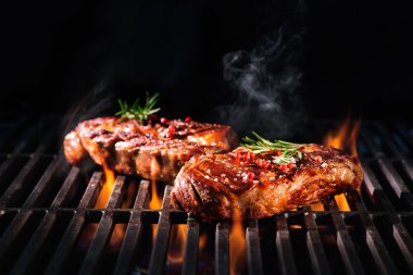 Beef steaks on the grill clipart