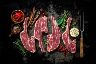 Raw fresh lamb meat on dark background clipart