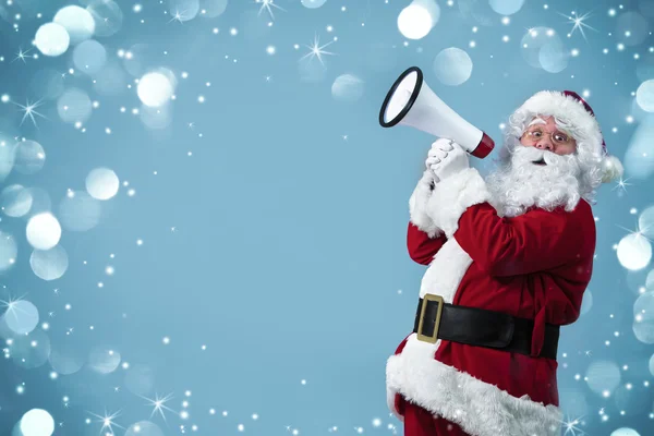 Papai Noel com um megafone — Fotografia de Stock