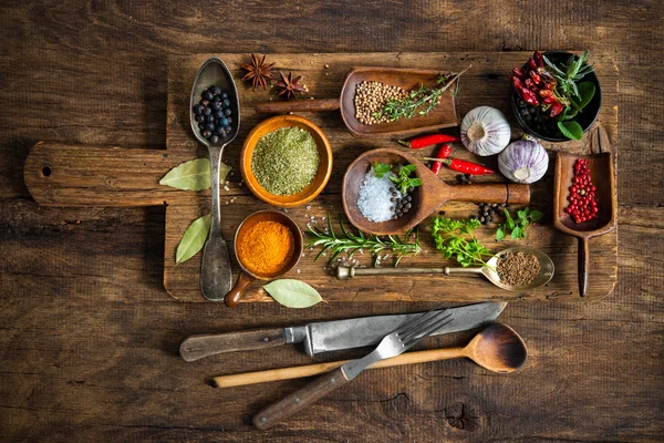 Colorful spices on wooden table — Stock Photo, Image