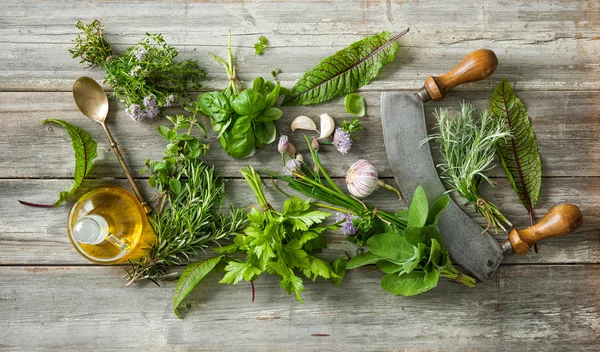 Fresh herbs and spices on wooden table — Stock Photo, Image