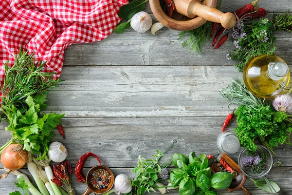 Fresh herbs and spices on wooden table — Stock Photo, Image