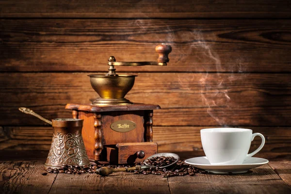 Coffee grinder, turk and cup of coffee — Stock Photo, Image