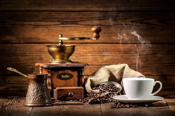 Coffee grinder, turk and cup of coffee — Stock Photo, Image