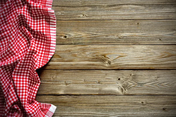 Tischdecke auf Holztisch — Stockfoto