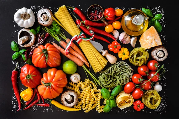 Italian food ingredients on slate background — Stock Photo, Image