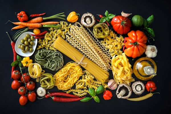 Italian food ingredients on slate background — Stock Photo, Image