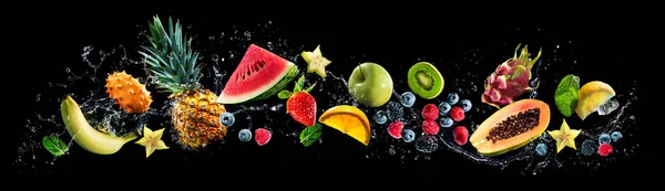 Panoramic wide black background with assortment of fresh fruits and water splashes. High resolution collage for skinali