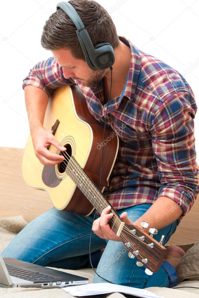 Musician playing acoustic guitar