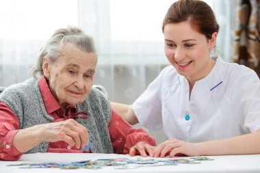 Senior woman with her elder care nurse clipart