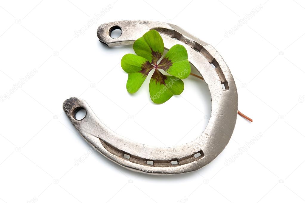 Horseshoes and clover with four leaf