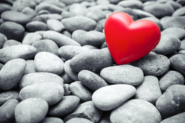 Red heart on pebble stones — Stock Photo, Image