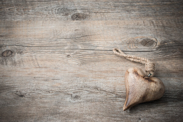 Heart on wooden background