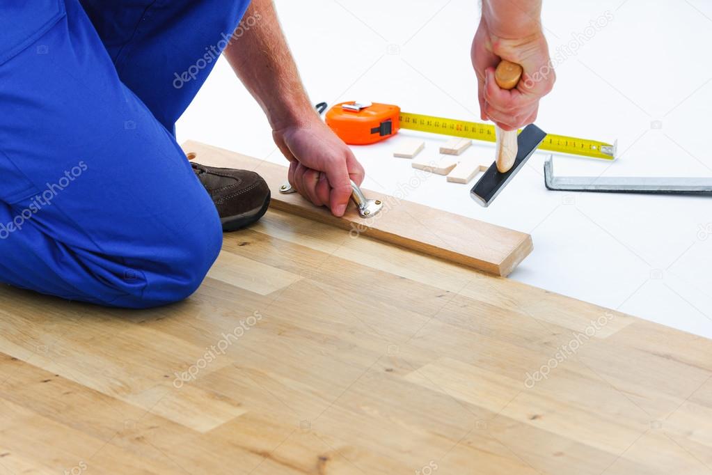 Man laying laminate flooring