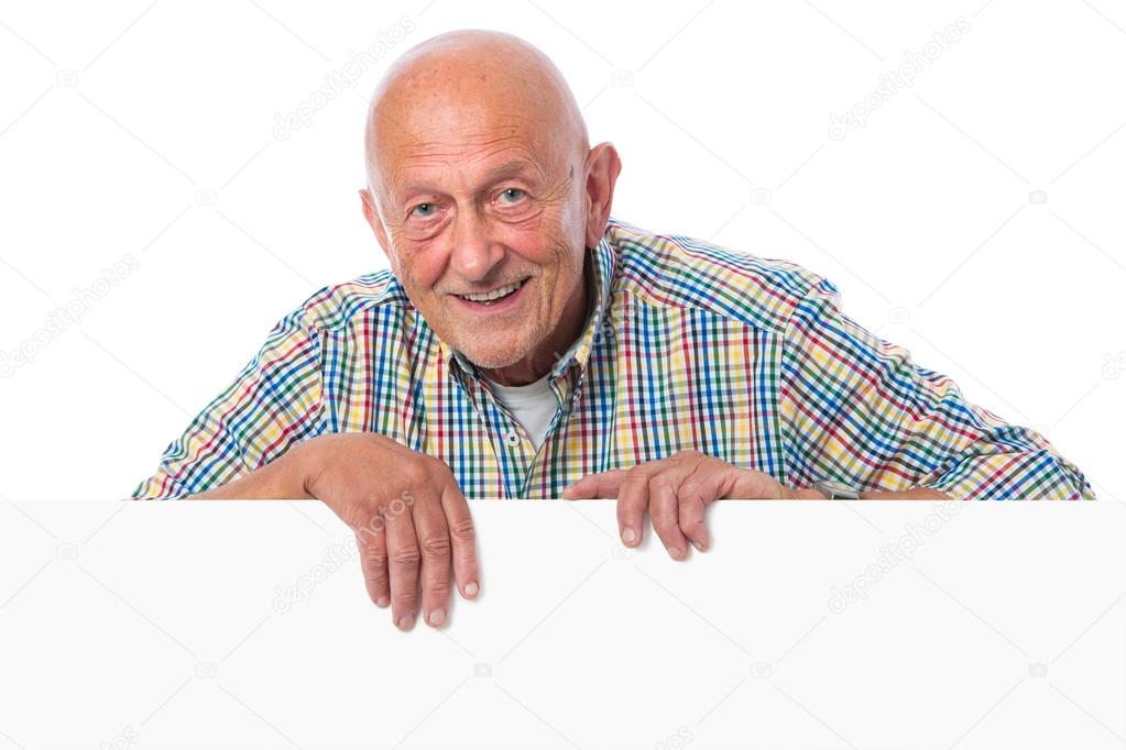 Senior man holds a blank board