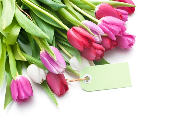 Bouquet of tulips with an empty tag — Stock Photo, Image