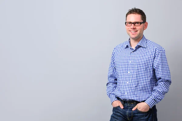 Portrait of a handsome young man smiling — Stock Photo, Image