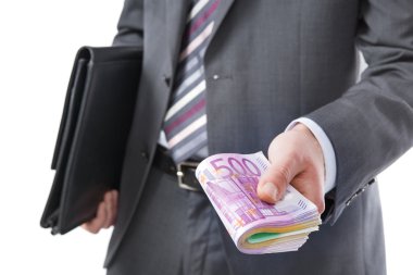Elinde para olan iş adamı.