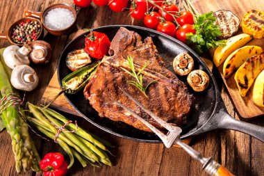 Beef steaks with grilled vegetables clipart