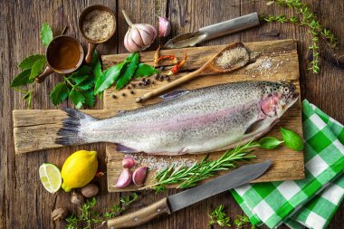 Fresh trout with spices and seasoning clipart