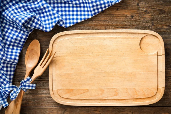 Kitchenware with a blue checkered tablecloth — Stock Photo, Image