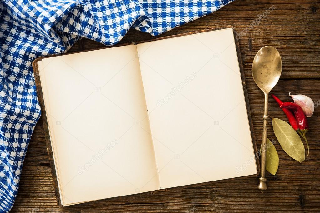 Open cookbook with kitchenware